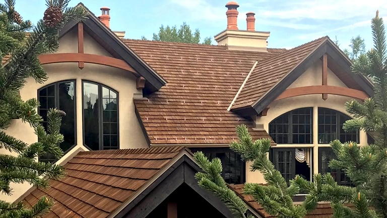 Pad-Style Snow Guards on Synthetic Cedar Shingle Roof
