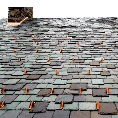 Multicolored, natural slate roof featuring retrofit FusionGuard pad-style copper snow guards to protect against galvanic corrosion.