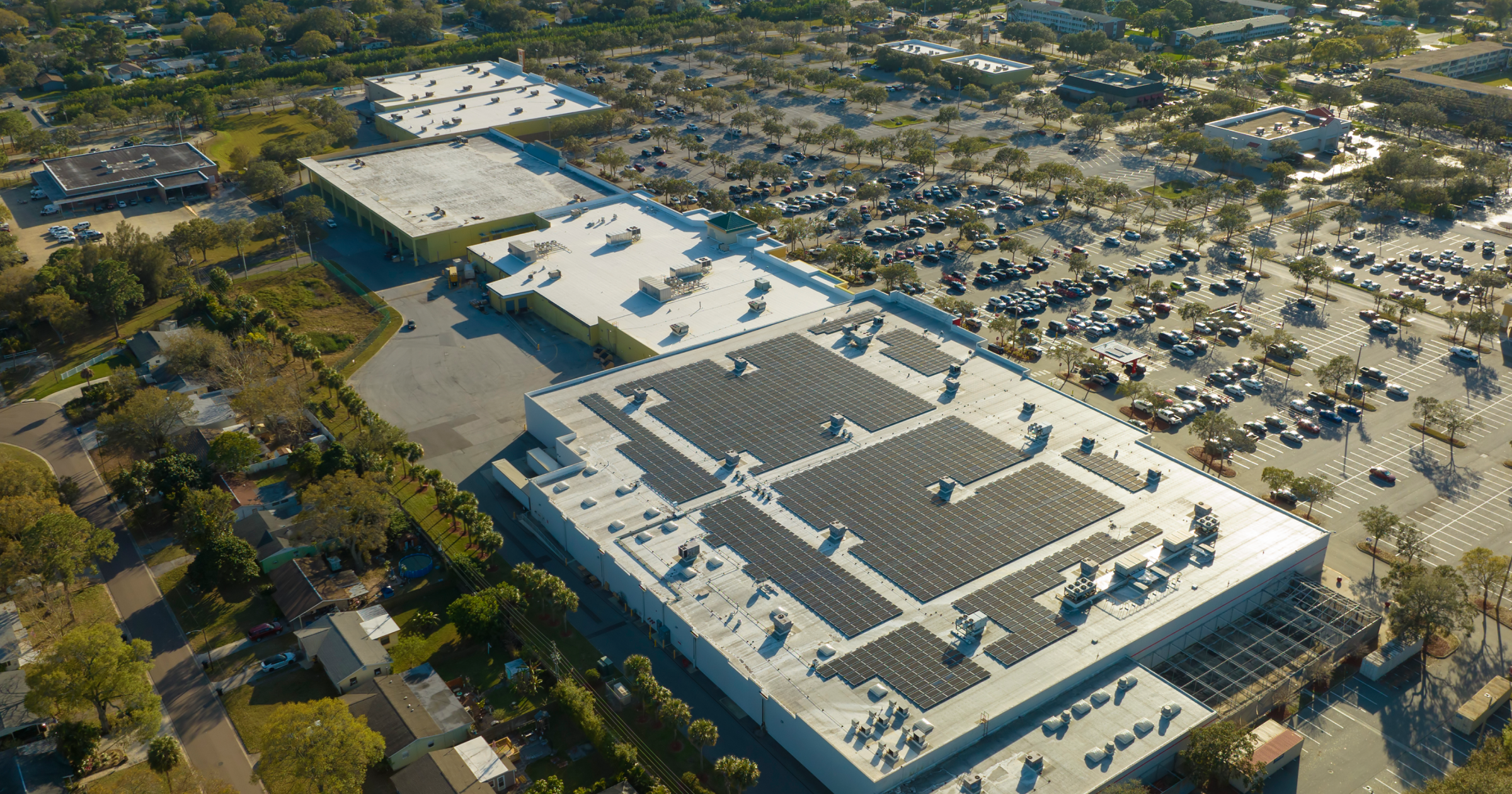 Large commercial building with a low-slope roof requiring an internal drainage system.