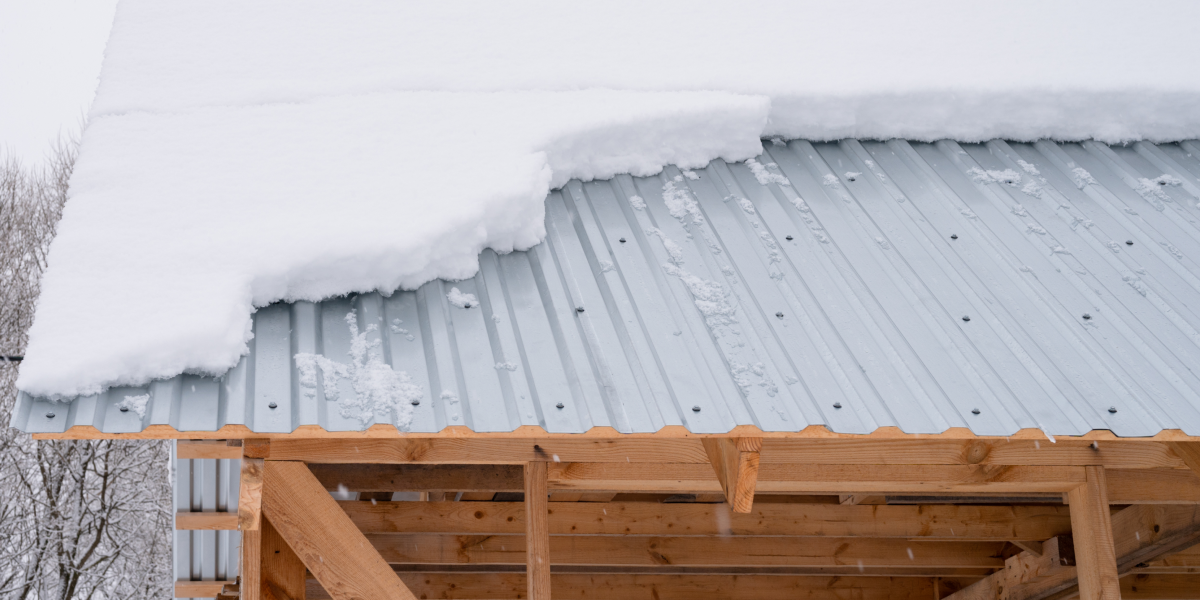 Corrugated metal roof with heavy snow accumulation. 