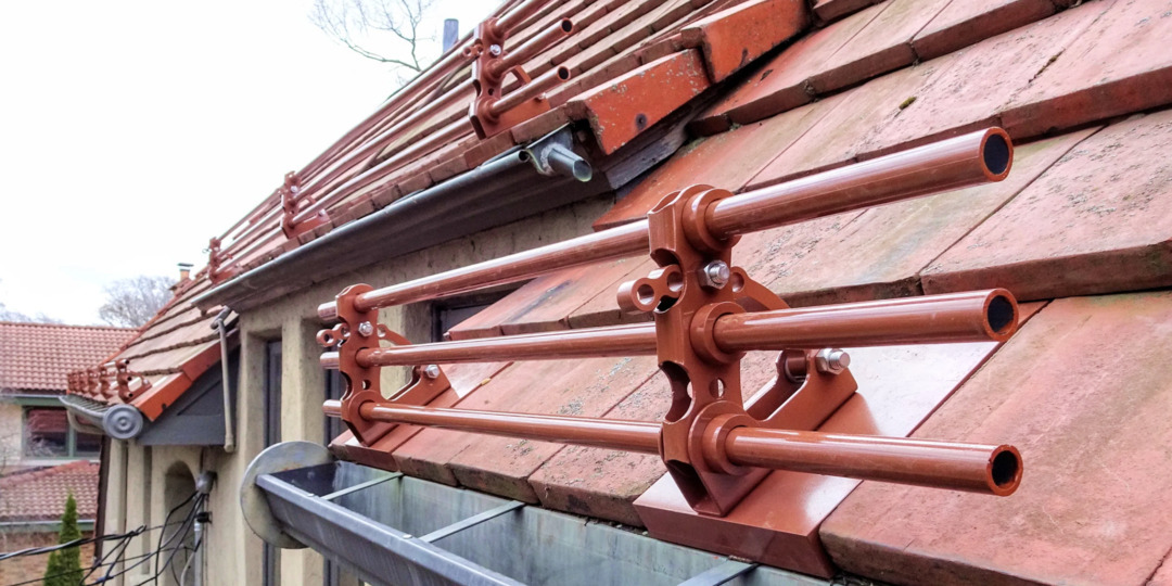 Bar style snow retention for Ludowici tile roof